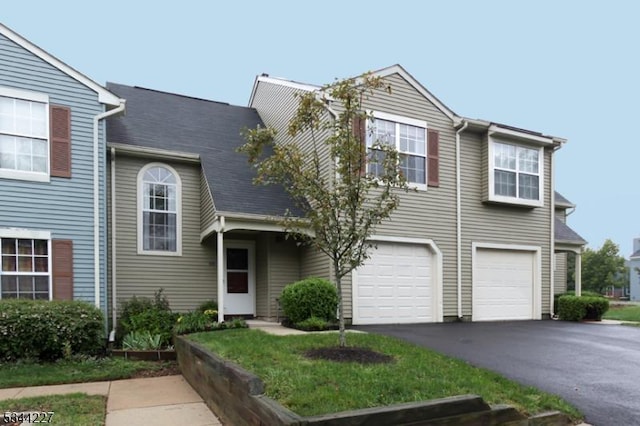 view of front facade with driveway and an attached garage