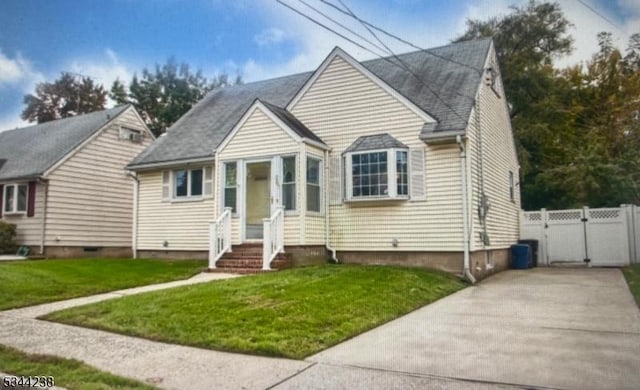 bungalow-style house with a front yard, a gate, fence, and crawl space