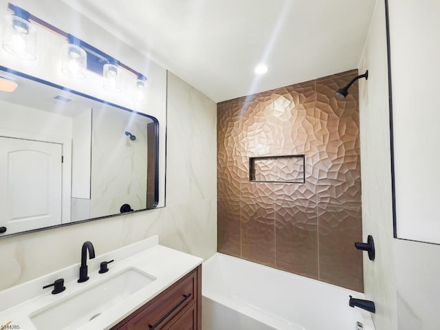 bathroom with vanity and shower / washtub combination