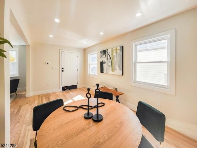 dining area featuring light wood finished floors, recessed lighting, and baseboards