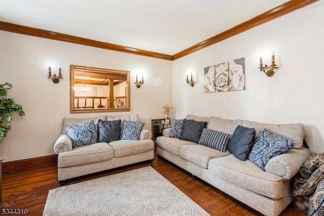 living area with baseboards, wood finished floors, and crown molding