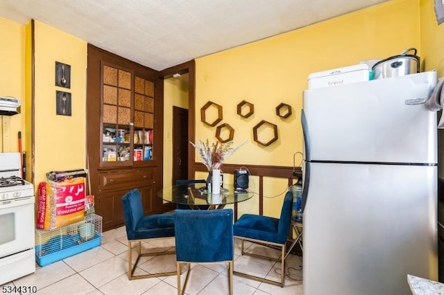 dining space featuring tile patterned floors