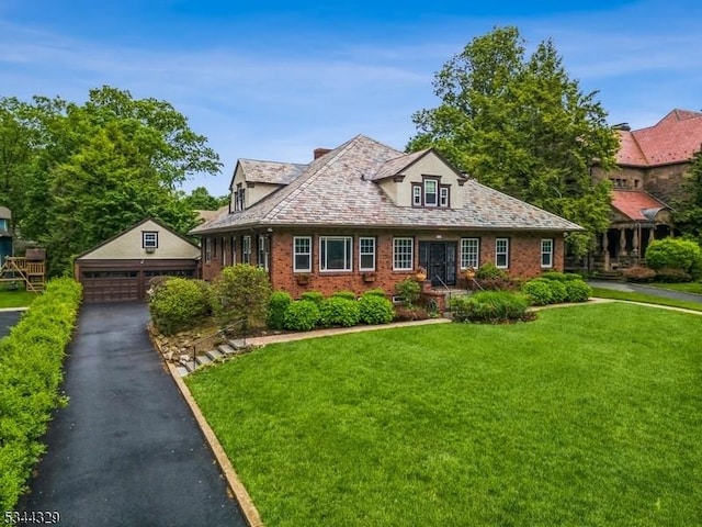 274 Ridgewood Ave, Glen Ridge Boro Twp, NJ 07028 - view of front of house featuring an outbuilding, a detached garage, a front yard, and brick siding
