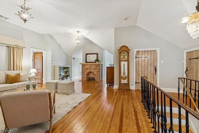 274 Ridgewood Ave, Glen Ridge Boro Twp, NJ 07028 - living area featuring a chandelier, lofted ceiling, wood finished floors, and baseboards