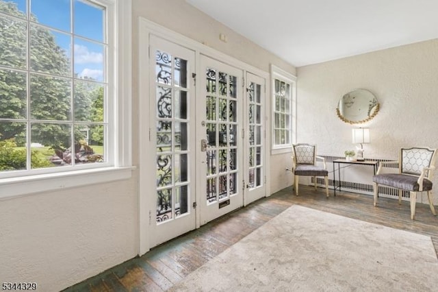 274 Ridgewood Ave, Glen Ridge Boro Twp, NJ 07028 - doorway to outside with a textured wall and wood-type flooring