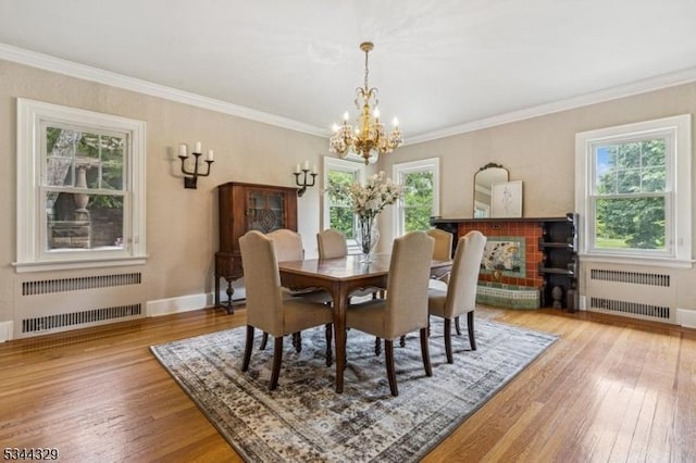 274 Ridgewood Ave, Glen Ridge Boro Twp, NJ 07028 - dining space with radiator heating unit, a chandelier, hardwood / wood-style flooring, and ornamental molding