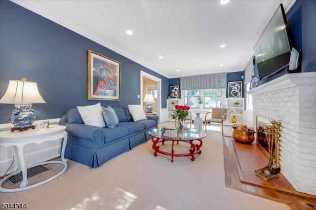 carpeted living area with recessed lighting, ornamental molding, and a brick fireplace