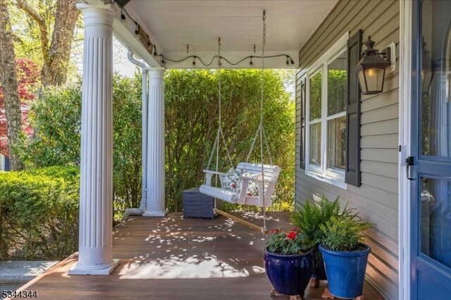 wooden terrace with covered porch