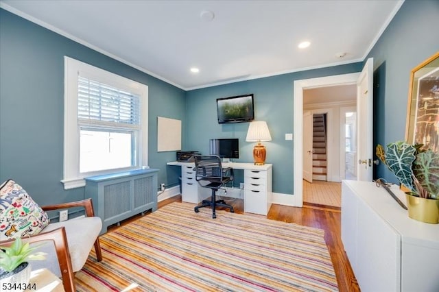 office space with baseboards, ornamental molding, recessed lighting, and wood finished floors