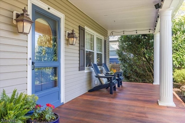wooden terrace with a porch