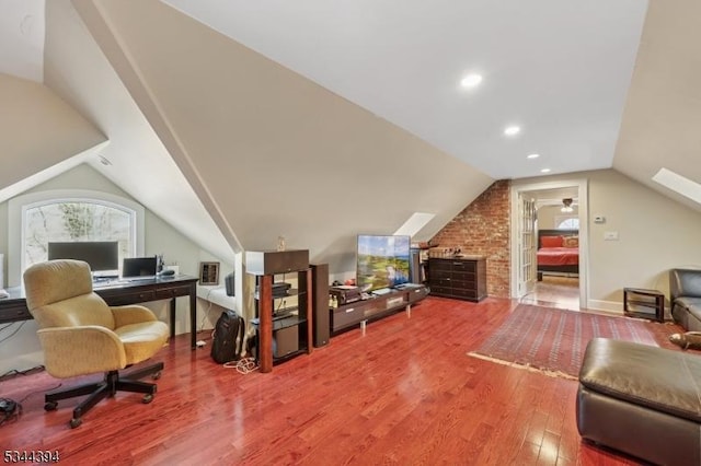 office featuring vaulted ceiling and wood finished floors