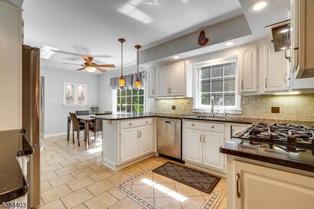 38 Beverly Dr, Hillsborough Twp, NJ 08844 - kitchen featuring appliances with stainless steel finishes, a peninsula, decorative backsplash, a ceiling fan, and recessed lighting