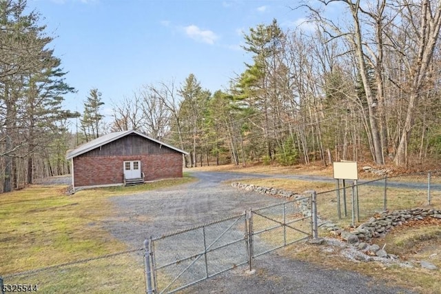 159 US Highway 206, Sandyston Twp, NJ 07826 - view of street with a gate, driveway, and a forest view