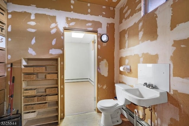 159 US Highway 206, Sandyston Twp, NJ 07826 - half bath featuring a sink, baseboard heating, and toilet