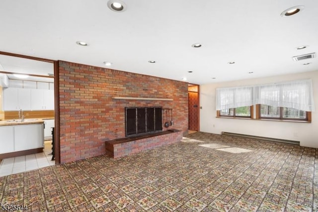 159 US Highway 206, Sandyston Twp, NJ 07826 - unfurnished living room with a brick fireplace, recessed lighting, visible vents, and a sink