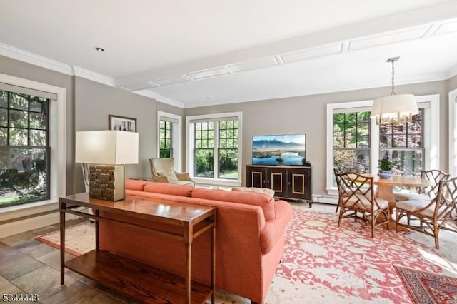 living room with crown molding, baseboards, a chandelier, and plenty of natural light