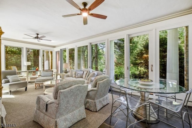 sunroom / solarium featuring crown molding and french doors
