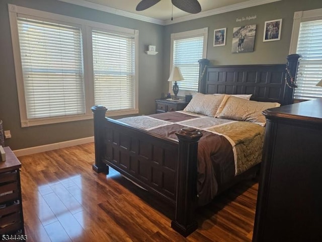 bedroom featuring ceiling fan, wood finished floors, baseboards, and ornamental molding