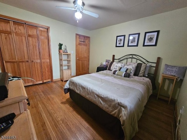 bedroom featuring baseboards, ceiling fan, and wood finished floors