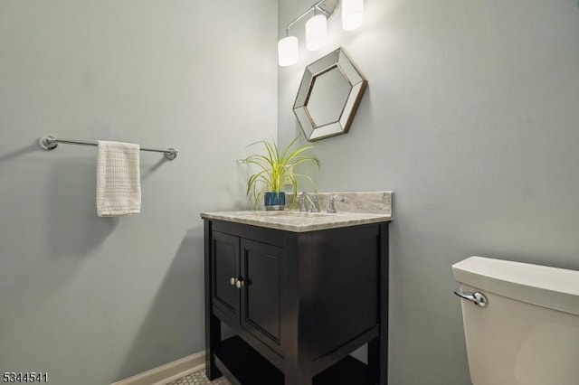 half bath with vanity and toilet