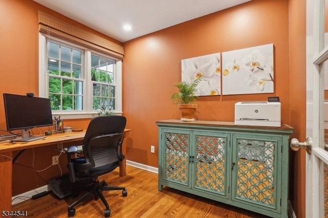 office featuring wood finished floors and baseboards