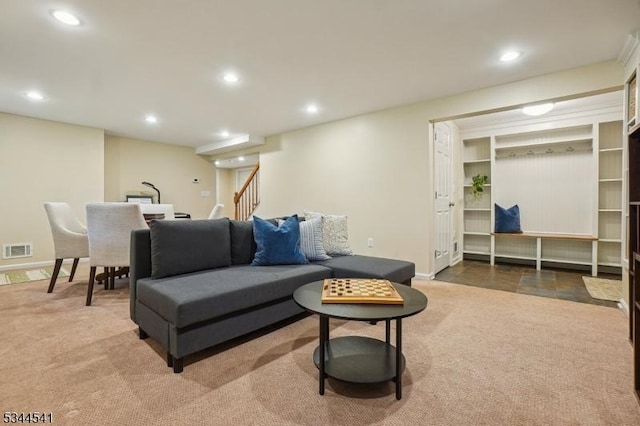 carpeted living area featuring recessed lighting, stairway, and baseboards