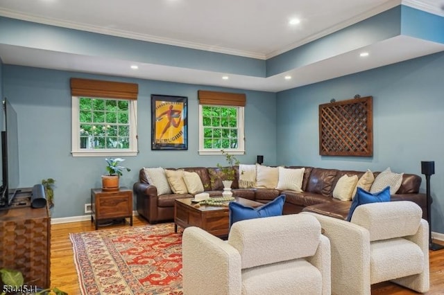 living area featuring crown molding, recessed lighting, and wood finished floors