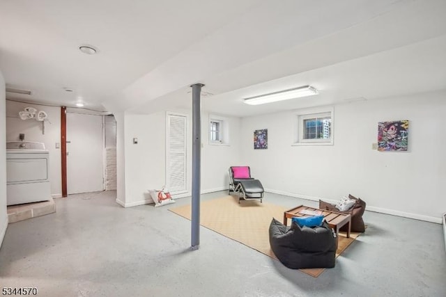 basement featuring washer / clothes dryer and baseboards