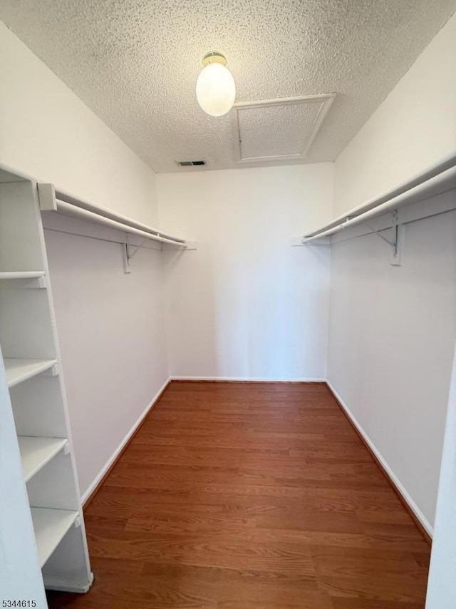 404 Azalea Ter, Branchburg Twp, NJ 08876 - walk in closet featuring wood finished floors and attic access