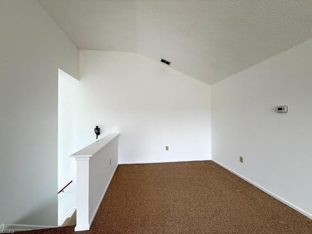 404 Azalea Ter, Branchburg Twp, NJ 08876 - unfurnished room with vaulted ceiling and dark colored carpet