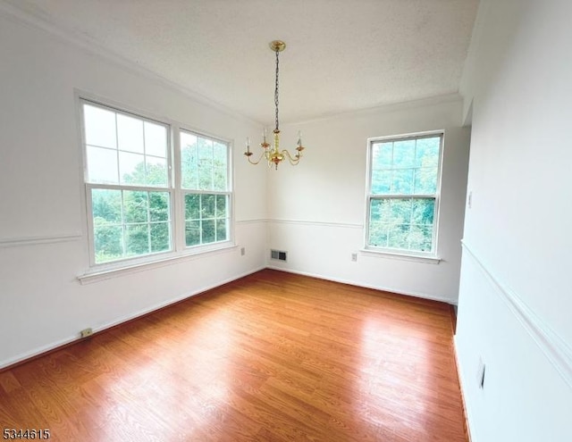 404 Azalea Ter, Branchburg Twp, NJ 08876 - unfurnished room featuring a chandelier, wood finished floors, and crown molding