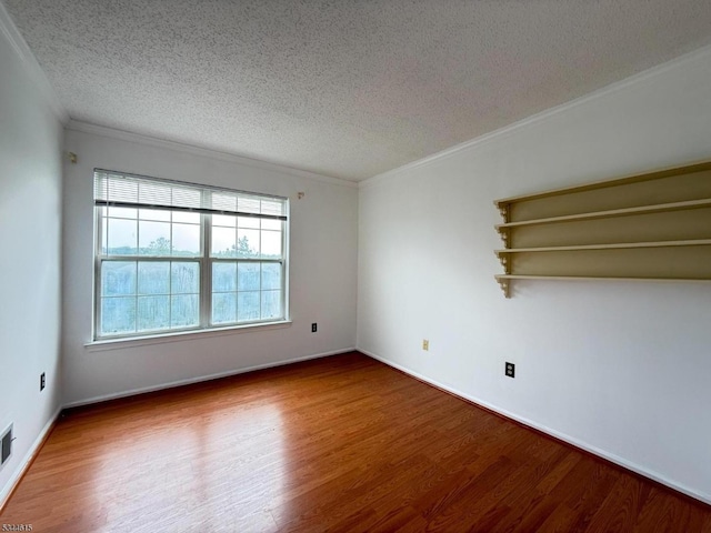 404 Azalea Ter, Branchburg Twp, NJ 08876 - unfurnished room with wood finished floors, a textured ceiling, and ornamental molding