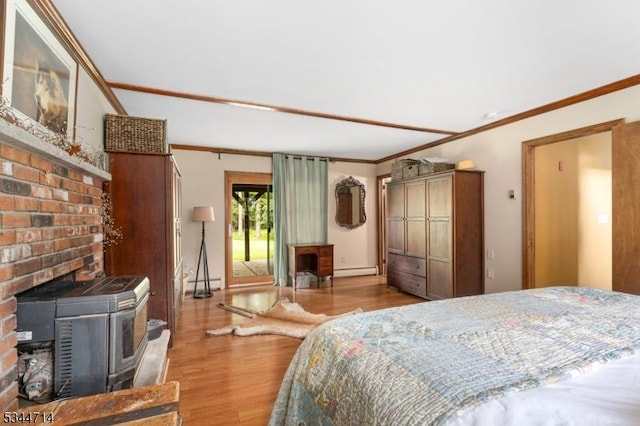 23 Devita Rd, Sandyston Twp, NJ 07826 - bedroom featuring a wood stove, wood finished floors, ornamental molding, a baseboard heating unit, and a baseboard radiator