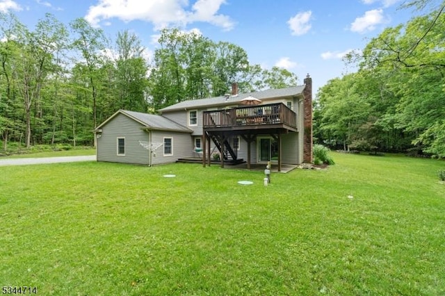 23 Devita Rd, Sandyston Twp, NJ 07826 - back of property featuring a deck, stairway, a lawn, and a chimney