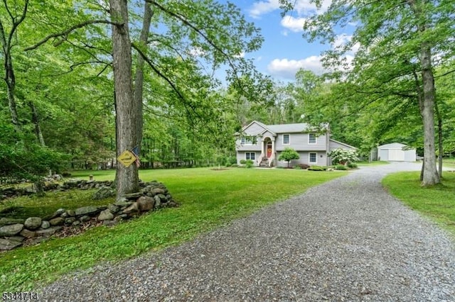 23 Devita Rd, Sandyston Twp, NJ 07826 - split foyer home featuring an outdoor structure, a front yard, and gravel driveway