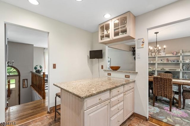 23 Devita Rd, Sandyston Twp, NJ 07826 - kitchen with glass insert cabinets, a chandelier, light stone countertops, recessed lighting, and a peninsula