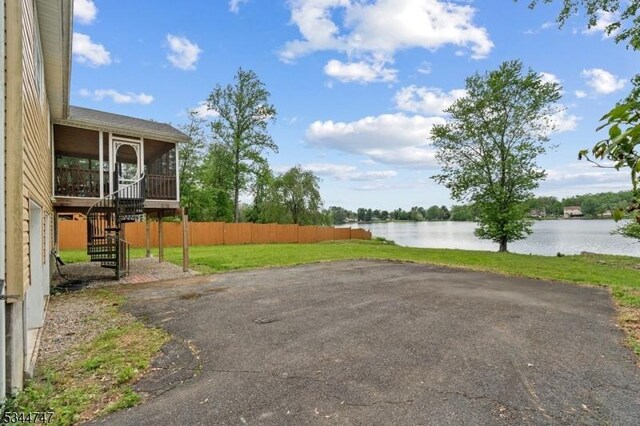 75 Shore Rd, Green Twp, NJ 07821 - view of yard featuring a sunroom, stairs, and a water view