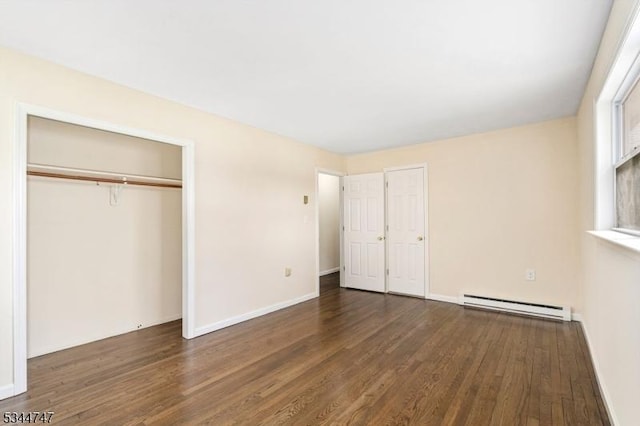 75 Shore Rd, Green Twp, NJ 07821 - unfurnished bedroom with baseboard heating, wood finished floors, baseboards, and a closet