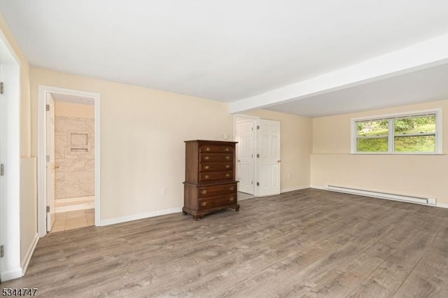 75 Shore Rd, Green Twp, NJ 07821 - unfurnished bedroom with a baseboard heating unit, wood finished floors, and baseboards
