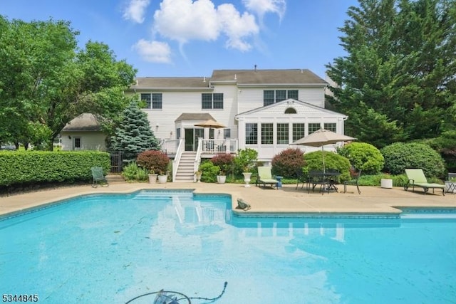 2 Wakefield Dr, Washington Twp, NJ 07840 - back of property featuring stairway, a deck, an outdoor pool, and a patio area