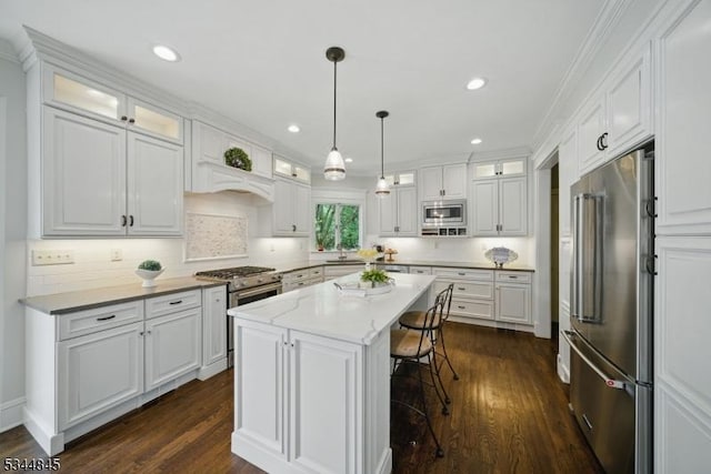 2 Wakefield Dr, Washington Twp, NJ 07840 - kitchen with appliances with stainless steel finishes, white cabinetry, a kitchen island, dark wood-type flooring, and recessed lighting