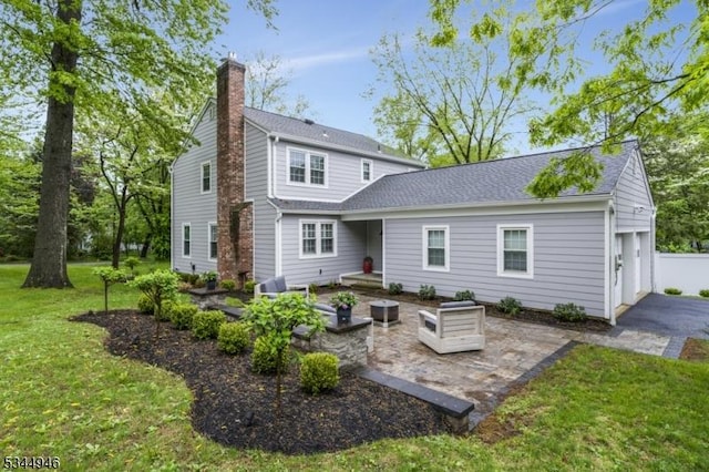 2 Columbia Dr, Bernardsville Boro, NJ 07924 - back of house featuring a yard, a chimney, a patio area, and roof with shingles