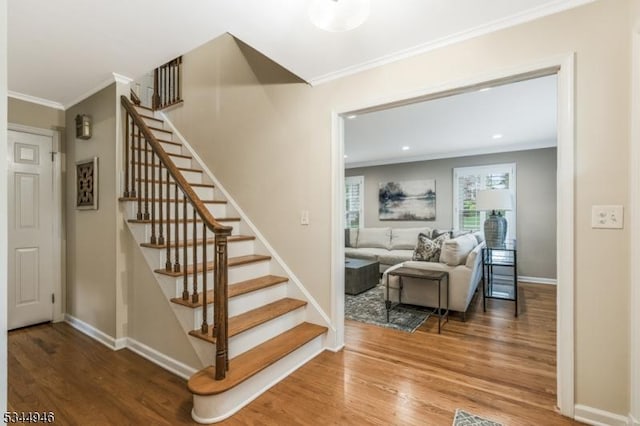 2 Columbia Dr, Bernardsville Boro, NJ 07924 - stairway with crown molding, wood finished floors, baseboards, and recessed lighting