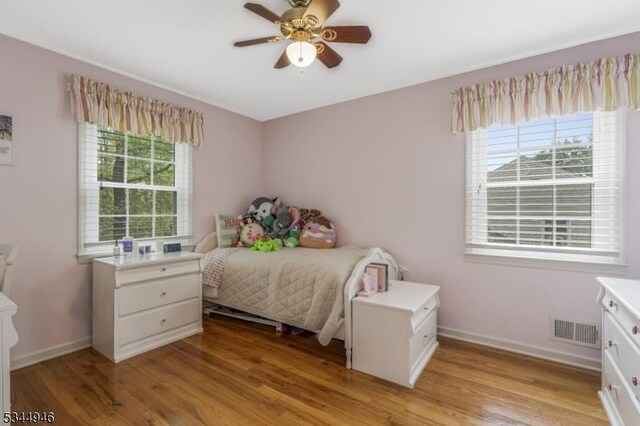2 Columbia Dr, Bernardsville Boro, NJ 07924 - bedroom featuring multiple windows, light wood-style floors, and baseboards