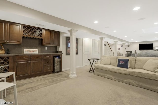 2 Columbia Dr, Bernardsville Boro, NJ 07924 - living area with bar, beverage cooler, light carpet, recessed lighting, and ornate columns