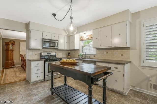2 Columbia Dr, Bernardsville Boro, NJ 07924 - kitchen with stainless steel appliances, a sink, healthy amount of natural light, and tasteful backsplash