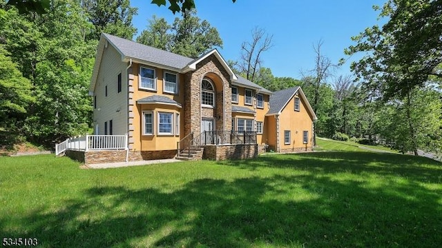 1121 N Washington Ave, Green Brook Twp, NJ 08812 - view of front of home with stone siding and a front lawn