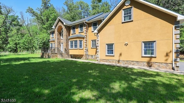1121 N Washington Ave, Green Brook Twp, NJ 08812 - rear view of house with a lawn and stucco siding