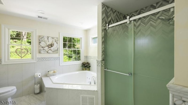 1121 N Washington Ave, Green Brook Twp, NJ 08812 - bathroom featuring a bath, a stall shower, and toilet