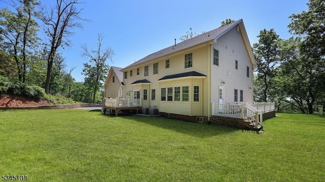 1121 N Washington Ave, Green Brook Twp, NJ 08812 - rear view of house featuring a deck and a yard